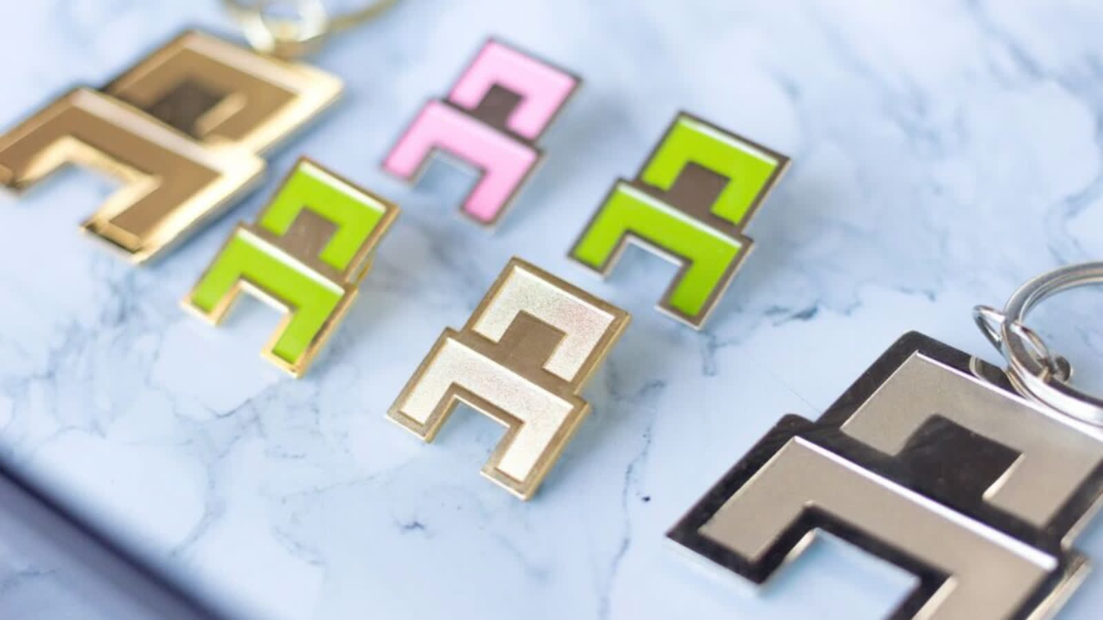 Chair brand pins and keychains