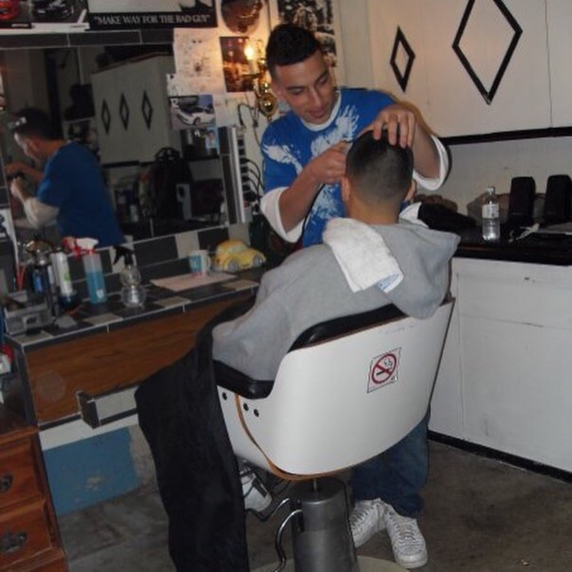 Brando in the early years cutting hair in another barber's shop