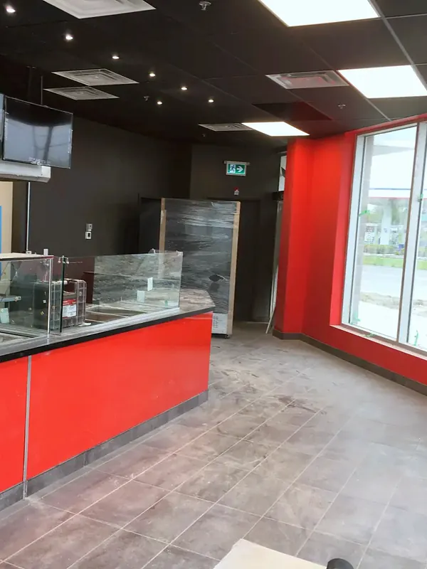 Red-fronted glazed service counter in the Bolton shawarma restaurant
