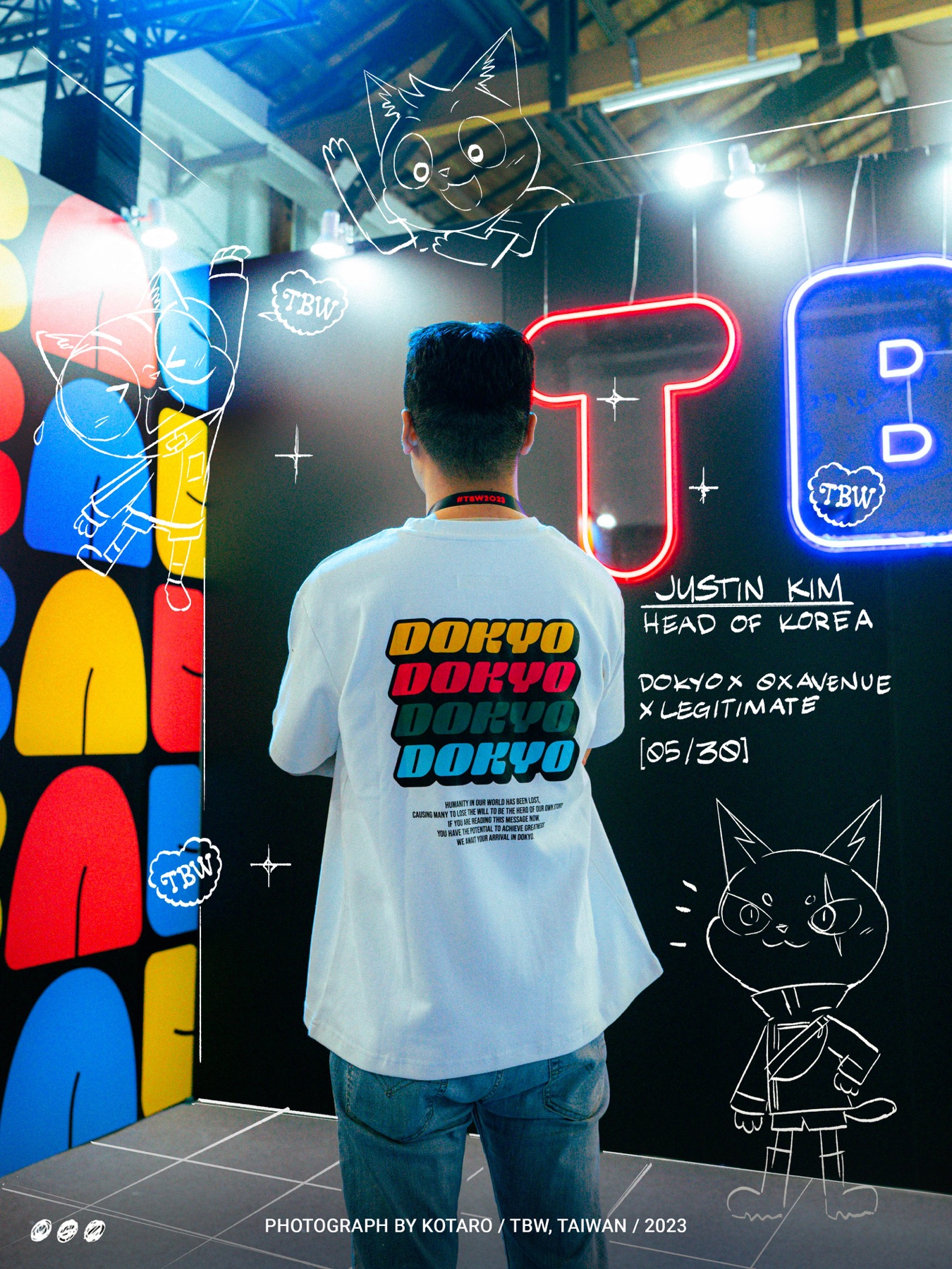 Justin Kim wearing the Dokyo merch tee at TBW Korea, neon backdrop