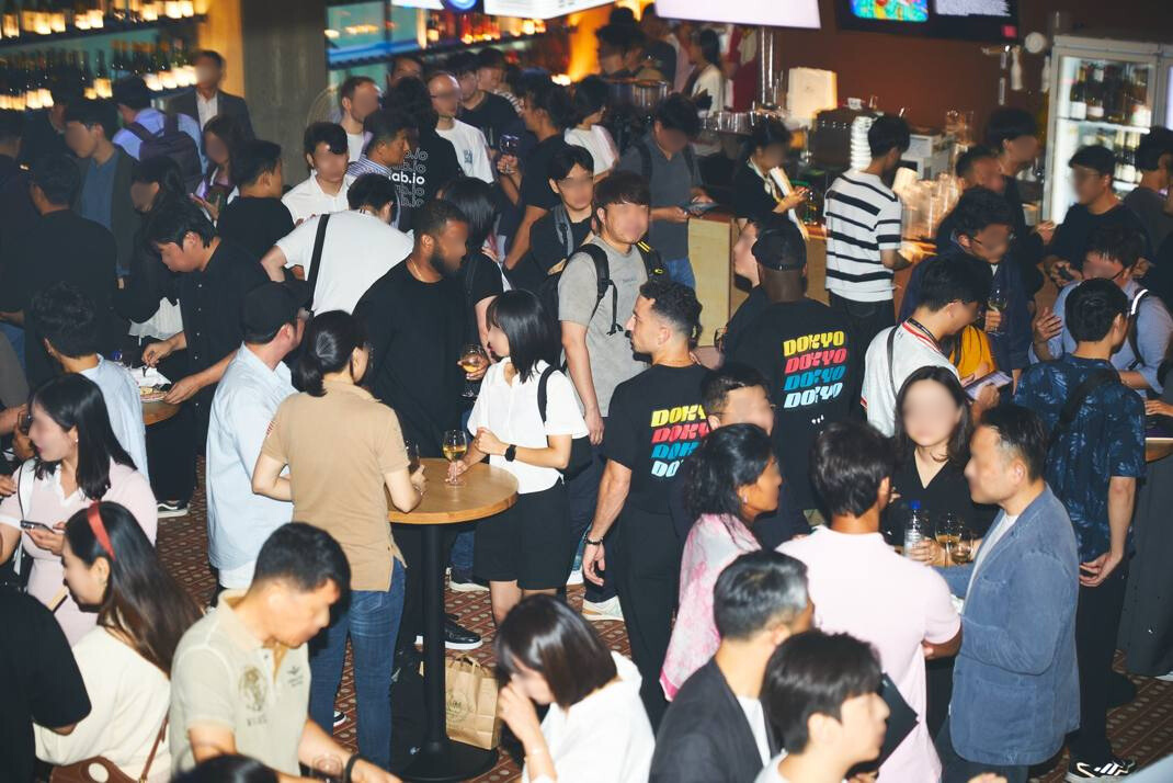 Korea Dokyo event crowd with merch in the room